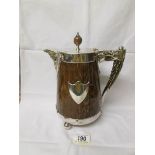 A 19th century oak and silver plate jug with ceramic lining.