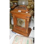 An oak bracket clock with key & pendulum