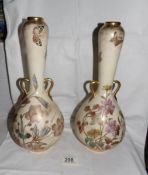 A pair of Minton vases with long necks and 2 small handles.