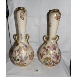 A pair of Minton vases with long necks and 2 small handles.