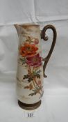 A Doulton early Pinder Bourne & Co. tall thin jug with anemone type flowers on opposite sides.
