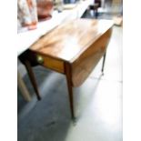 A Victorian mahogany Pembroke table.