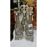 A 3 bottle silver plated tantalus,