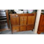 An oak ecclesiastical cabinet