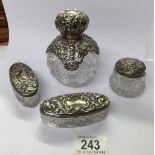 A silver topped hobnail cut glass scent bottle and 3 silver topped trinket pots.