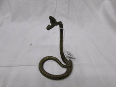 An early 20th century brass pocket watch holder in the form of a snake.