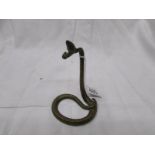 An early 20th century brass pocket watch holder in the form of a snake.