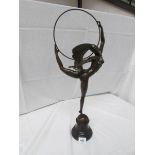 A bronze hoop dancer signed Morantz, approximately 69 cm tall.