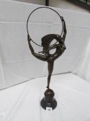 A bronze hoop dancer signed Morantz, approximately 69 cm tall.