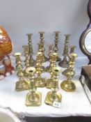 7 pairs of Victorian brass candlesticks.