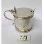 A silver mustard pot with blue glass liner and complete with spoon, T B & S, 1917.