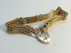 A hall marked 9ct gold ladies four bar gate bracelet, approximately 15.9 grams.