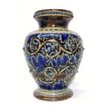 An 1875/76 Doulton Lambeth rounded vase by Emma Martin having a blue pattern on a brown ground with