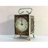 A silver and tortoise shell carriage clock (fine crack to tortoise shell front).
