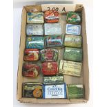 A collection of old gramophone needle tins, some with needles.