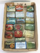 A collection of old gramophone needle tins, some with needles.