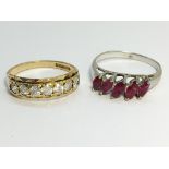 A 9ct gold 5 stone ring, size O half and a five stone silver and garnet ring, size P.