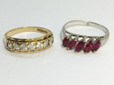 A 9ct gold 5 stone ring, size O half and a five stone silver and garnet ring, size P.