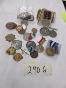 A mixed lot of badges, coins, medals etc.