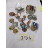 A mixed lot of badges, coins, medals etc.