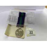 A Palestine medal with paperwork.