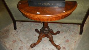 A walnut Victorian round card table