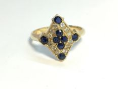 A high carat yellow gold diamond shaped sapphire and diamond ring, size N.