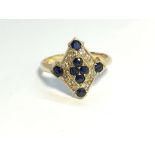 A high carat yellow gold diamond shaped sapphire and diamond ring, size N.