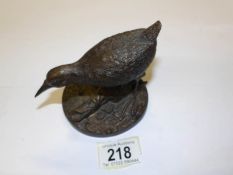 A cast metal wading bird.