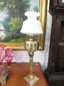 A tall Victorian brass oil lamp 1860-1900.