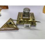 A Victorian brass ink stand, an enameled dip pen and a pen stand.