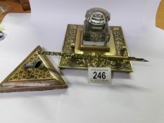 A Victorian brass ink stand, an enameled dip pen and a pen stand.