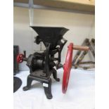 An old grinder/mincer on stand.