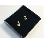 A pair of white gold and diamond ear studs.