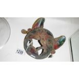A Chinese metal cat mask.