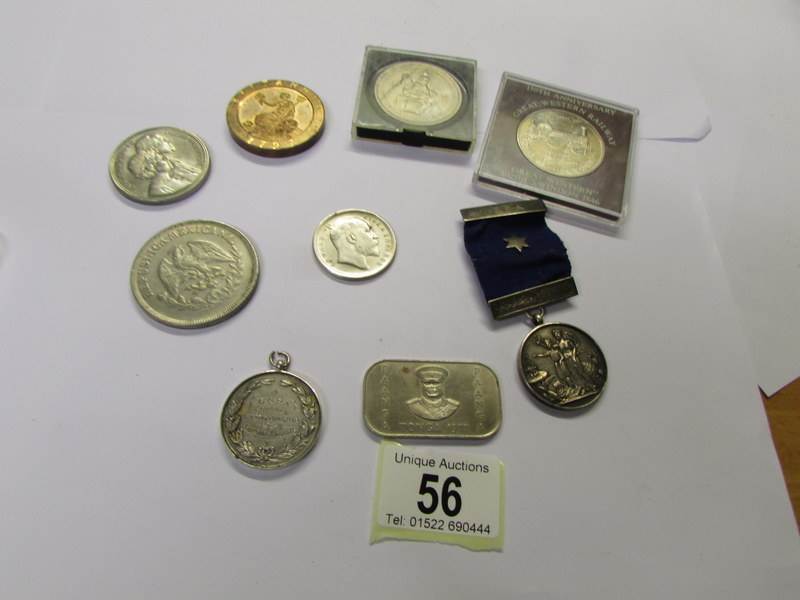 A small collection of coins and medallions.