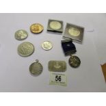 A small collection of coins and medallions.
