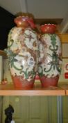 A pair of early 19th century vases, 16" tall with raised birds at top & middle.
