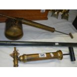 A brass Wikeham weed eradicator, a brass sprayer and one other item.