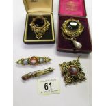 2 ornate gilt pendant/brooches set large stones, another pendant and 2 stone set brooches.