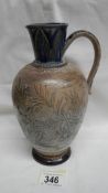 A Doulton Lambeth 1880 jug depicting a lion family (4 cubs, lion and lioness) amongst grasses.