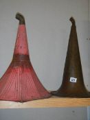 A 19th century brass gramophone horn and a painted steel gramophone horn.