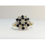 A 9ct gold sapphire and diamond cluster ring, hall marked HAN, Birmingham 1986, size O.