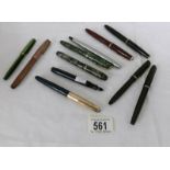 A collection of vintage fountain pens etc.