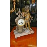 A clock with cherub on marble base