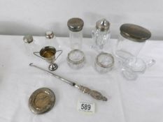 A quantity of silver topped jars etc.