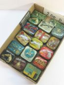 A collection of gramophone needle tins, some with needles.