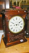 A rosewood bracket clock with key & pendulum,