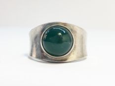 An early Georg Jensen ring set with agate cabachon, No. 124, size N half.