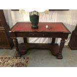 A 19th century leather topped mahogany writing table.